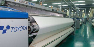 How to reduce weaving defects on air-jet looms during fabric production?